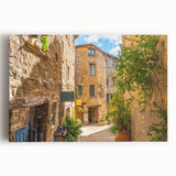 Stretched canvas wall art featuring a vibrant cityscape design, showcasing colorful buildings and a lively street scene, perfect for modern home decor.
