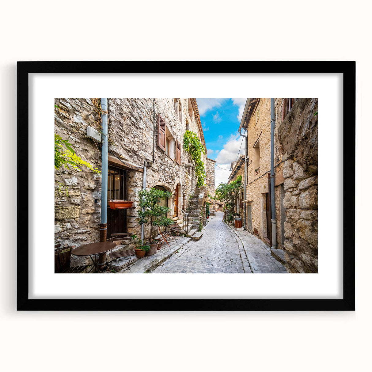 Framed wall art collection featuring a minimalist black frame with a mat, showcasing a vibrant landscape design, ideal for modern home decor.