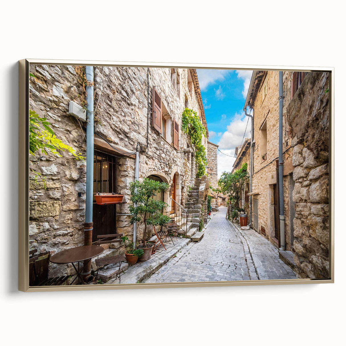 Framed canvas wall art featuring a modern landscape design with vibrant colors and gold accents, displayed in a chic interior setting, highlighting its elegance.
