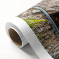 Colorful rolled canvas showcasing a vibrant abstract landscape design, ideal for modern home decor, packaged securely in a protective cardboard tube.