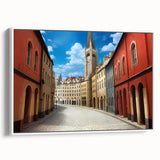 Framed canvas wall art showcasing a contemporary street landscape design in vibrant colors, displayed from a side view against a white background, perfect for modern home decor.