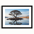 Framed wall art featuring a serene landscape design with trees, set in a sleek black frame and white matting, ideal for home decor enhancement.