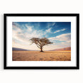Framed black wall art featuring a serene landscape design with trees, presented in a sleek mat for an elegant display. Ideal for home decor enthusiasts.