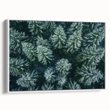 Framed canvas wall art showcasing a serene landscape with lush green trees, featuring a modern white frame and elegant side view display, ideal for home decor.