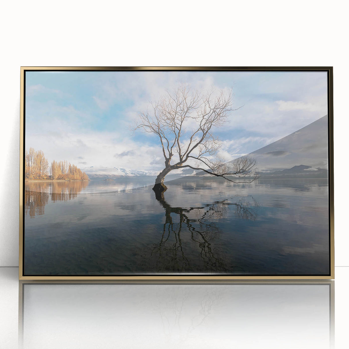 Framed acrylic wall art depicting a vibrant landscape with trees, featuring gold accents. Perfect for adding a touch of nature and elegance to home decor.