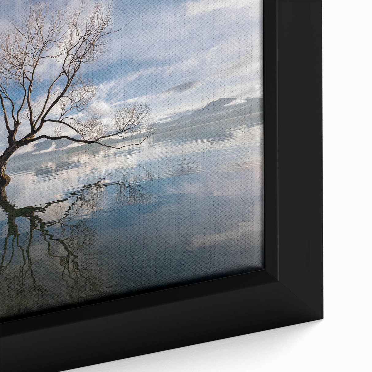 Framed wall art showcasing a close-up of vibrant green leaves and textured bark from a tree, adding a natural touch to home decor. Perfect for nature enthusiasts.