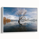 Framed canvas wall art featuring a serene landscape with tall green trees set against a white background, showcasing a modern design perfect for home decor.