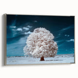 Framed canvas wall art featuring a serene landscape with trees, showcasing vibrant colors and a sleek silver frame, perfect for enhancing home decor.