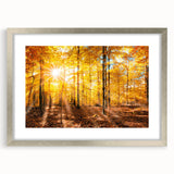 Framed wall art featuring a serene landscape with trees, displayed in a silver frame with a white mat, perfect for enhancing home decor and adding tranquility.