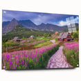 Acrylic glass wall art featuring a vibrant landscape design of a serene valley, showcasing rich greens and blues, framed with decorative pins for an elegant display.