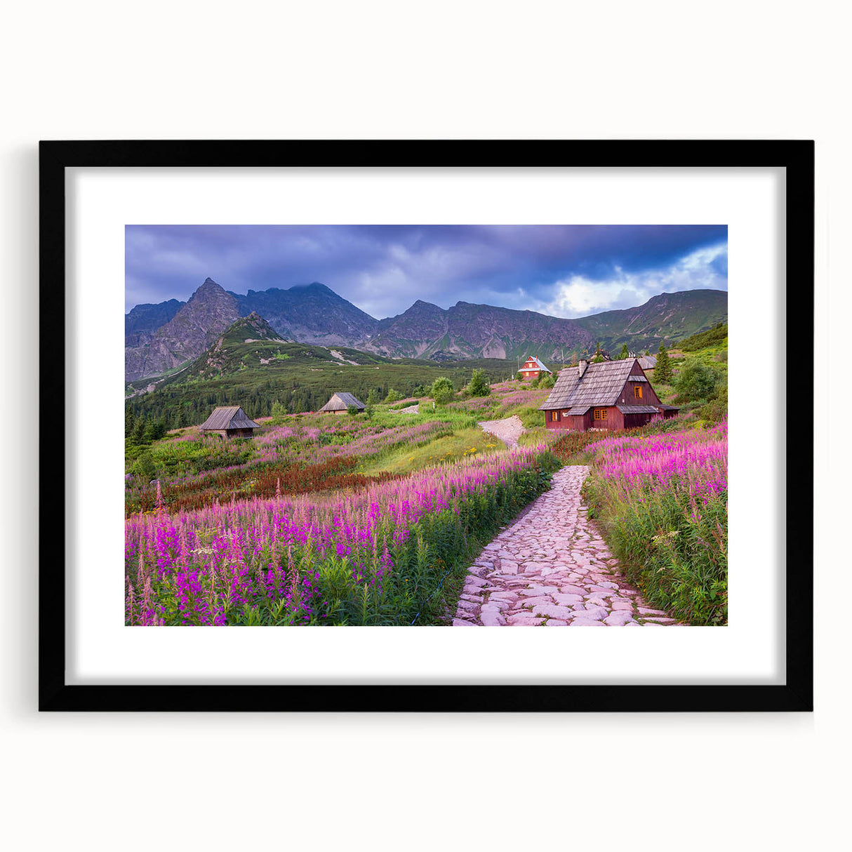 Framed wall art collection featuring a serene landscape of a valley, with a black frame and mat, perfect for home decor. Ideal for nature enthusiasts and art lovers.
