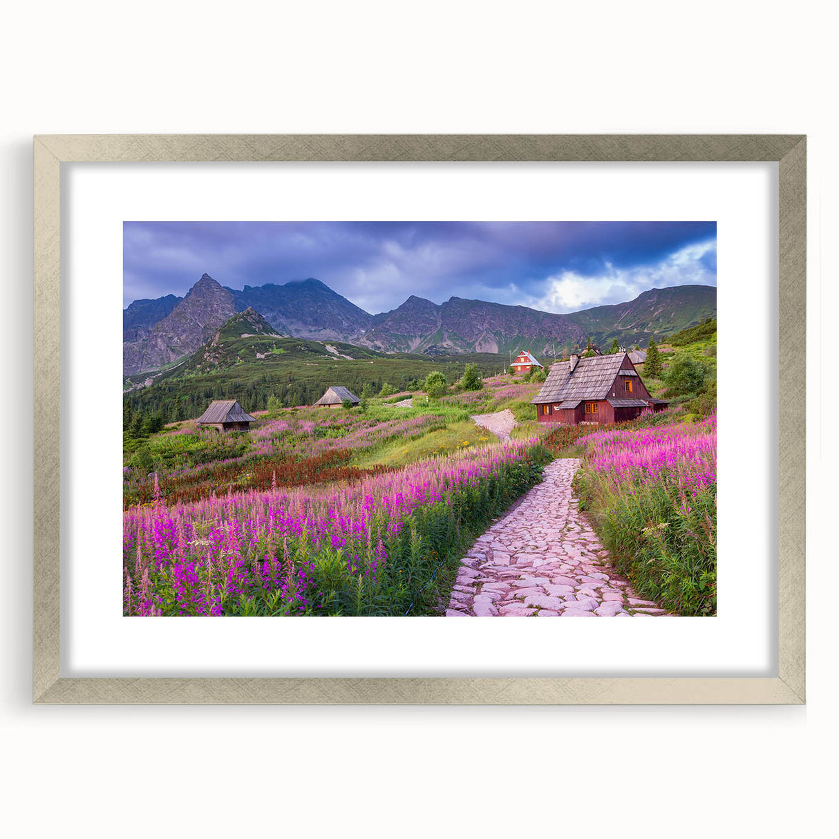 Framed wall art of a serene valley landscape design, featuring a silver mat, showcasing lush greenery and rolling hills, perfect for home decor.