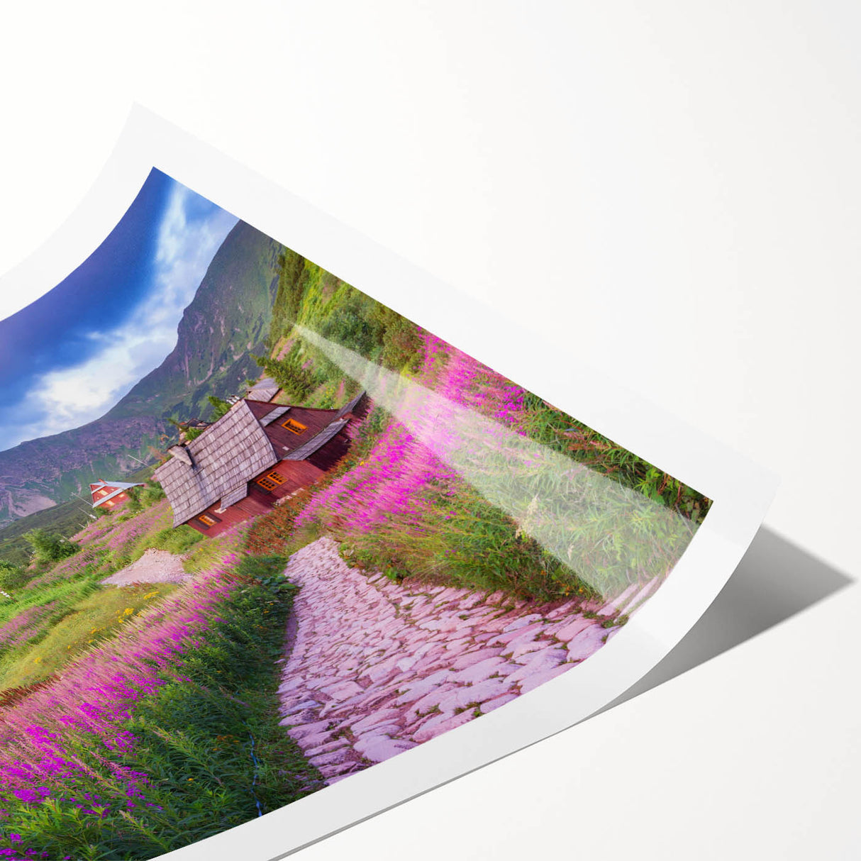 Vibrant rolled print of a serene valley landscape, showcasing lush green hills and a clear blue sky, ideal for enhancing home decor with natural beauty.