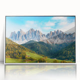 Framed acrylic wall art depicting a serene valley landscape with lush greenery and blue skies, designed to enhance home decor with natural beauty.