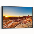 Framed canvas wall art depicting a serene valley landscape with rich green hues and dramatic mountain silhouettes. The artwork features a sleek black frame, enhancing its modern aesthetic. Perfect for adding a touch of nature to contemporary home decor.