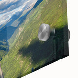 Close-up of a vibrant acrylic glass wall art piece depicting a serene valley landscape, showcasing rich colors and intricate details, perfect for home decor.