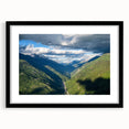 Black-framed wall art featuring a serene valley landscape with vibrant colors, ideal for home decor, showcasing nature's beauty in a modern design.