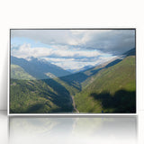 Framed acrylic wall art featuring a serene valley landscape design, showcasing vibrant greens and soft blues, perfect for modern home decor.