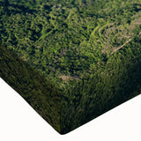 Close-up of a stretched canvas showcasing a vibrant landscape valley design, featuring rich colors and intricate details, perfect for enhancing home decor.