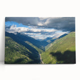 Stretched canvas wall art showcasing a serene valley landscape design in vibrant greens and blues, leaning against a modern decor backdrop, ideal for home or office aesthetics.