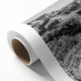 Vibrant rolled canvas artwork depicting a serene valley landscape with lush greenery and mountains, ideal for home decor or office settings.