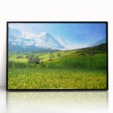 Framed artwork of a serene valley landscape, featuring lush green hills and a clear blue sky, with a sleek black frame enhancing its contemporary look. Perfect for home decor enthusiasts seeking nature-inspired wall art.