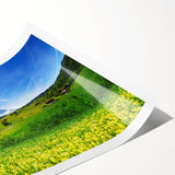 Rolled print showcasing a serene valley landscape with vibrant colors, ideal for home decor. Packaged in a protective cardboard tube for easy transport and storage.