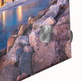 A close-up view of a vibrant acrylic glass wall art piece showcasing a colorful village landscape design. The artwork features intricate details, rich colors, and a glossy finish, perfect for home decor enthusiasts. Ideal for enhancing interior spaces with a touch of cultural charm.