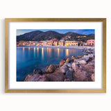 Framed wall art collection showcasing a serene village landscape design with a gold mat, perfect for home decor; emphasizes tranquility and nature.