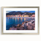 Framed silver wall art showcasing a picturesque village landscape, featuring vibrant colors and intricate details, perfect for enhancing home decor and creating a serene atmosphere.