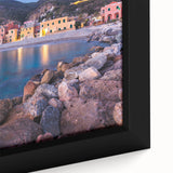 Close-up of a framed canvas wall art collection showcasing vibrant village landscapes, featuring rich colors and intricate details, perfect for home decor.