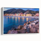 Framed canvas wall art showcasing a serene landscape of a quaint village, featuring lush greenery and soft pastel colors, ideal for home decor and enhancing ambiance.