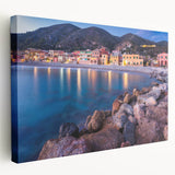 Stretched canvas wall art showcasing a serene village landscape design, featuring vibrant greens and earthy tones, perfect for home decor enhancement.