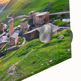 Close-up of a vibrant acrylic glass wall art piece showcasing a picturesque village landscape, featuring rich colors and intricate details, perfect for home decor.