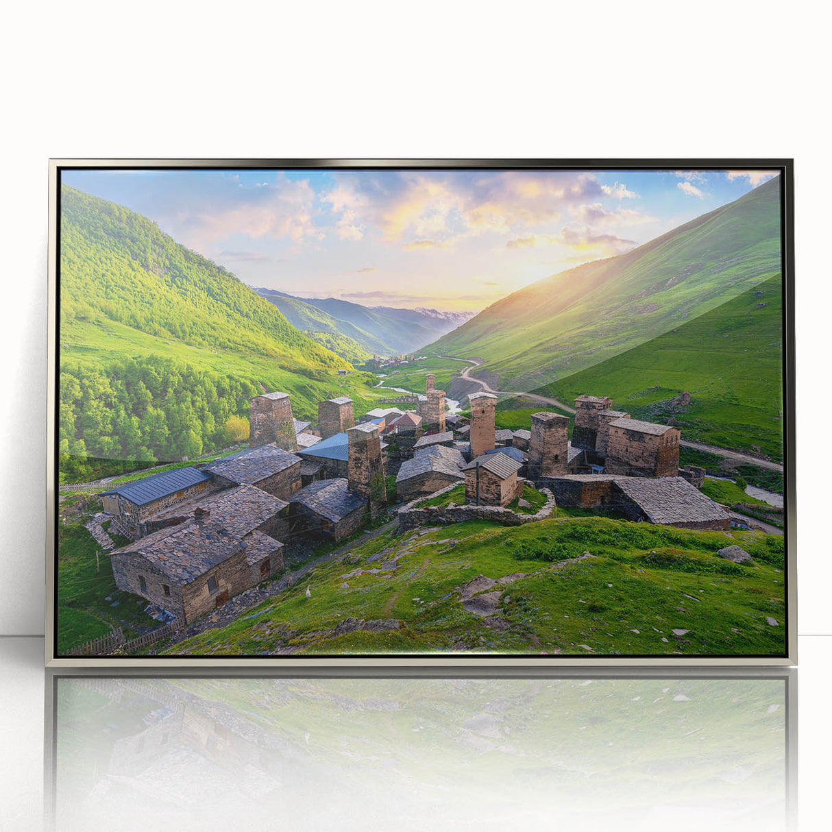 Framed acrylic wall art showcasing a vibrant village landscape design with intricate details and a silver frame, ideal for home decor and enhancing interior aesthetics.