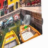 Close-up of a vibrant acrylic glass wall art design showcasing a picturesque village landscape, featuring rich colors and intricate details that enhance home decor. This artwork adds a serene and artistic touch to any interior space.