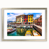 Framed wall art featuring a serene village landscape design in soft colors, elegantly displayed with a silver mat, ideal for home decor enhancement.