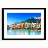Framed landscape wall art collection featuring serene village scenes in muted colors, displayed in a sleek black frame with a white mat, ideal for home decor.