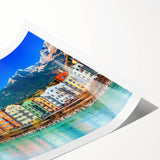 Rolled print of a vibrant landscape village design wall art, showcasing colorful houses and lush greenery, ideal for home decor, presented in a protective cardboard tube.