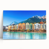 Colorful stretched canvas wall art depicting a serene landscape village scene, showcasing vibrant hues of green and blue, perfect for home decor enhancement.