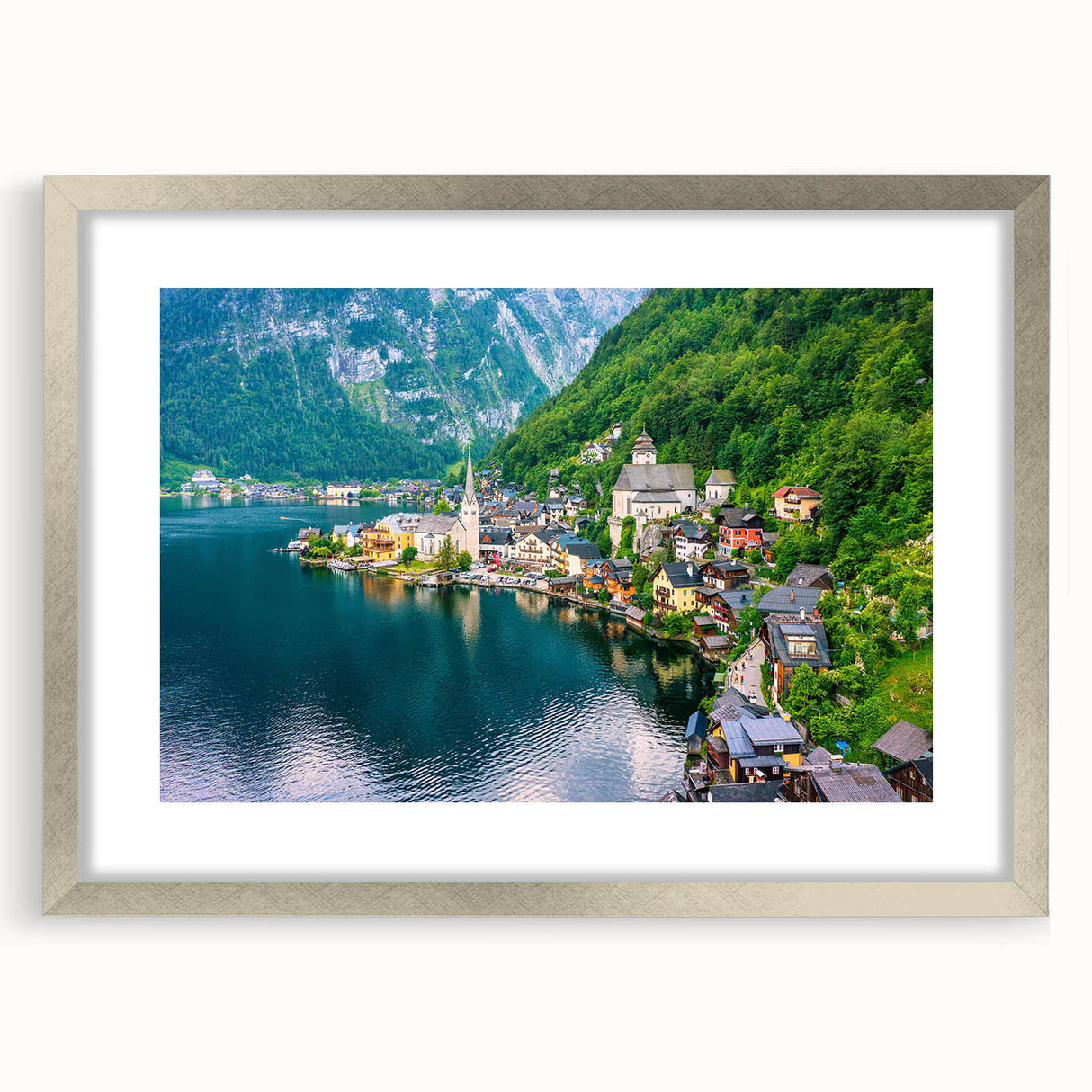 Framed wall art collection showcasing a serene village landscape with vibrant colors and intricate details, set in a stylish silver frame with a mat, perfect for home decor.