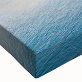 Close-up of a stretched canvas wall art piece showcasing a vibrant landscape village design, featuring rich colors and intricate details, perfect for home decor.