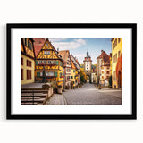 Black-framed wall art featuring a stunning landscape village design, showcasing vibrant colors and intricate details, perfect for home decor enhancement.