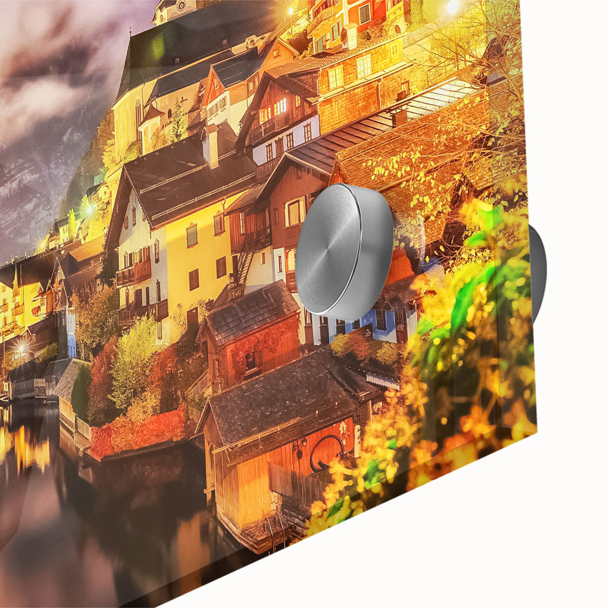 Close-up of an acrylic glass wall art piece showcasing a vibrant village landscape, featuring colorful houses set against a scenic backdrop, ideal for home decor.