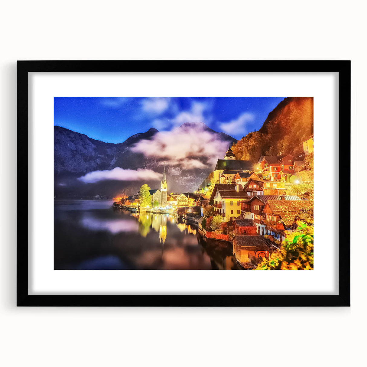 Framed wall art featuring a picturesque village landscape design, set in a sleek black frame with a white mat, perfect for home decor and interior styling.