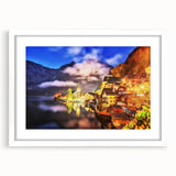 Framed wall art featuring a serene village landscape with vibrant colors and intricate details, set against a white mat, ideal for home decor enhancement.