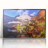 Framed acrylic wall art depicting a serene village landscape with lush greenery and vibrant colors, enhancing home decor with an elegant silver frame.