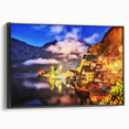 Framed canvas wall art depicting a serene village landscape design, featuring vibrant colors and intricate details, presented in a stylish black frame, ideal for home decor.