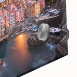 Close-up of a vibrant acrylic glass wall art piece showcasing a picturesque village landscape, featuring lush greenery and tranquil blue skies, ideal for home decor.