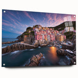 Acrylic glass wall art featuring a vibrant landscape village design, showcasing colorful houses and greenery, displayed from a side view with decorative pins.